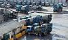 Ready-mixed concrete vehicles pulled up at a construction site in Seoul on Dec. 8. [YONHAP]