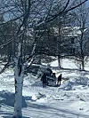 A van carrying 10 travelers, including nine Korean tourists, is stuck in the snow during a severe snowstorm, in Williamsville, New York. [ALEXANDER CAMPAGNA]