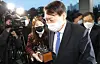 Prosecutor General Yoon Seok-youl enters the Supreme Prosecutors' Office on Tuesday after the Seoul Administrative Court issued an injunction to temporarily lift his suspension. [YONHAP]