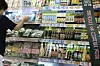 A customer shopping for groceries at a store in Seoul on Monday. Inflation in June rose 6 percent, the highest in 24 years. [YONHAP]