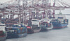 Export ships docked at a port in Busan. The global trade order has been changing rapidly, leaving Korea, which relies on trade, vulnerable. [YONHAP]