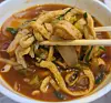 Eomuk Udon, or fish cake udon, is one of the specialties to try out at Bupyeong Kkangtong Market, Jung District, Busan. [SOHN MIN-HO]