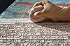 Artist Shin Yong-il meticulously writes Chinese letters with a mixture of soil and water. The letters are from “Jikji Simche Yojeol,” which roughly translates to 'Anthology of Great Buddhist Priests’ Zen Teachings' at his studio in Gunpo, Gyeonggi. [PARK SANG-MOON]