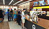 People shop at the third Emart24 store in Malaysia on Wednesday. [EMART24]