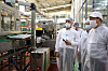 Lotte Group Chairman Shin Dong-bin, right, at Lotte Chilsung Beverage factory in Anseong, Gyeonggi, on Wednesday. [LOTTE CORPORATION]