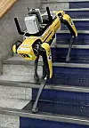 Spot, a four-legged robot developed by Boston Dynamics, walks down the stairs at Incheon City Hall in Namdong District, Incheon, on Thursday. GS Engineering & Construction plans to use the robot to collect information on smart city buildings during construction. [YONHAP]