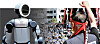 From left, the Atlas humanoid robot, and members of Hyundai Motor labor union stage a protest for wage increase in Ulsan on Sept. 3, 2025. [REUTERS/YONHAP]