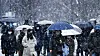 People are on their way to work on Thursday morning in Jongno District, central Seoul, as snow falls heavily in the area. [NEWS1]