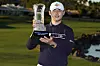 Kim Si-woo holds the winner's trophy at the end of The American Express tournament in La Quinta, California, on Sunday. [AP/YONHAP]