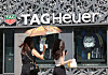 Passersby walk in front of a TAG Heuer store in Seoul on Sunday. [YONHAP]
