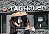 Passersby walk in front of a TAG Heuer store in Seoul on Sunday. [YONHAP]