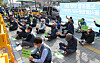 Taekbae Union, which represents delivery workers, demands logistics companies improve the work environment for delivery workers in Gwangjin District, eastern Seoul, Monday. [YONHAP]