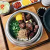 Steak sot bab, or rice served in a pot, sold at Damsot [LEE TAE-HEE]