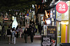 A sign advertises round-the-clock service in Hongdae, western Seoul, on Tuesday night after social distancing measures were lifted in Korea. [NEWS1]