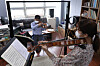 A music professor at Seoul National University instructs his student in viola while separated by a transparent divider set up to abide by social distancing guidelines. [YONHAP]
