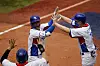 Korea's Oh Ji-hwan, center, celebrates with his teammates after hitting a two-run home run during a baseball game against Israel at Yokohama Baseball Stadium during the 2020 Tokyo Olympics on Monday. [AP/YONHAP]