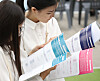 Visitors attending the Job Fair for International Students in July last year look at the list of hiring companies. [NEWS1]