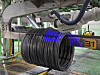 A wire rod tagging robot attaching the tag [HYUNDAI STEEL]