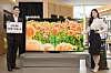 Samsung Electronics ranked No. 1 in the global TV market for the 16th consecutive year, the company said Sunday. According to the electronics maker, the company's TVs took up 29.5 percent of TV sales based on revenue generated from sales and 19.8 percent based on the number of TVs sold. Samsung Electronics models pose beside the company's popular Neo QLED TV model in a showroom in southern Seoul, holding up a sign reading, '16 years global TV market No. 1.″ [SAMSUNG ELECTRONICS]