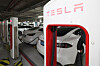 Tesla vehicles are being charged at a building in Seoul on Jan. 3.  [YONHAP]