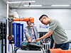 Kim Dong-seon, managing director of Hanwha Hotels & Resorts, tests the performance of the Hanwha Robotics' collaborative robot at the Hanwha R&D Center located in Seongnam, southern Gyeonggi. [HANWHA ROBOTICS]