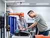 Kim Dong-seon, managing director of Hanwha Hotels & Resorts, tests the performance of the Hanwha Robotics' collaborative robot at the Hanwha R&D Center located in Seongnam, southern Gyeonggi. [HANWHA ROBOTICS]