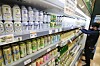An employee organizes cans of non-alcoholic beer on a shelf at a discount store in Seoul on Thursday. As more Koreans prefer to drink responsibly, competition for non-alcoholic beer is heating up. Hite Jinro was the first to enter the market, followed by Chinese Tsingtao, which launched a low-alcohol beer on June 11. Market leader Oriental Brewery Company said it plans to launch a non-alcoholic beer this year. [YONHAP]