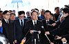Democratic Party Chairman Lee Jae-myung, center, speaks on the proportional representation system during a press conference at the May 18 National Cemetery in Gwangju on Monday. [YONHAP]