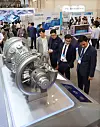 Attendees of the 2024 World Climate Industry Expo (WCE) observe a model of a gas turbine made by Doosan for use in aviation and power generation on Wednesday. [YONHAP]