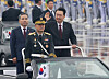 President Yook Suk Yeol, right, conducts a military review in a car during a ceremony to mark the 75th anniversary of Armed Forces Day at Seoul Air Base in Seongnam, Gyeonggi, Tuesday. [JOINT PRESS CORPS]