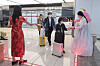 Officials from the Korea Airports Corporation dressed in traditional clothing distribute souvenirs to arriving passengers at Gimpo International Airport on March 27. [YONHAP]