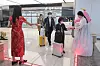 Officials from the Korea Airports Corporation dressed in traditional clothing distribute souvenirs to arriving passengers at Gimpo International Airport on March 27. [YONHAP]