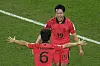 Kim Young-gwon, right, celebrates with teammate Hwang In-beom after scoring Korea's first goal during the Group H match between Korea and Portugal at the 2022 FIFA World Cup at Education City Stadium in Al Rayyan, Qatar on Friday. [AP/YONHAP]