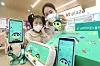 Models display KT's new LTE smartphone for kids, the KT Shinbi Kids Phone 3, on Thursday. The sale of the phone will begin Friday. [YONHAP].