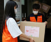 G Foundation workers deliver sanitary kits to a local childrens center. [G FOUNDATION]
