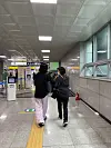 Engelstoft, with Lee, walking in a subway station in Daegu on June 24. [NATIONAL CENTER FOR THE RIGHT OF THE CHILD]