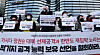 Members of a civic group rally in front of the Japanese Embassy in Seoul on Monday to protest a revision in Japan's national security strategy that would give the country counterstrike capabilities. [NEWS1]