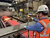 A worker at Posco checks the production of steel products at its steel mill in Pohang, North Gyeongsang Province, on Sept. 13, as the company resumes operations after a weeklong suspension due to Typhoon Hinnamnor. [YONHAP]