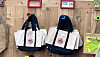 Trader Joe's canvas tote bags hang on the wall at Trader Joe's store in Los Angeles. [CHO YONG-JUN]