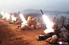 North Korea conducts an artillery drill, apparently testing tactical guided missiles Thursday, in a photo released by the state-run Korean Central News Agency Friday. [YONHAP]