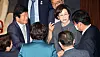 Reps. Park Byeong-seug, left, Kim Sang-hee, center, and Kim Jin-pyo, right, talk before the National Assembly session on Wednesday. [YONHAP]