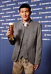 Bayern Munich center back Kim Min-jae poses in lederhosen and a janker jacket while holding a pint of Paulaner beer at a promotional event in a photo shared by the club on Wednesday. Both garments are traditionally worn in the Bavaria region where Kim now plays. [SCREEN CAPTURE]