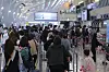 Gimpo International Airport's terminal for domestic flights is crowded with people traveling for the first weekend without any social distancing measures except for those related to masks on Friday. [YONHAP]