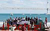 BTS fans gather at Gwangalli Beach in Busan on Thursday before joining a plogging program, which combines jogging and picking up trash. Fans have descended on the coastal city to celebrate BTS member Jimin’s birthday and the boy band’s concert on Saturday, which has been organized to promote Busan’s bid to host World Expo 2030. [YONHAP]