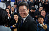 Democratic Party leader Lee Jae-myung smiles after securing victory for Incheon's Gyeyang-B constituency at his election war room on Thursday. [JOINT PRESS CORPS]
