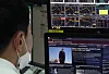 A stockbroker reads news about the U.S. presidential election, Tuesday, in the trading room of Hana Bank, Jung District, central Seoul. Amid anticipation, the Kospi index rose 43.15 points, or 1.88 percent, to 2,343.31. Voting is Tuesday across the United States. [NEWS1]