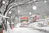A snowplower drives through a street covered in snow in Geochang County, South Gyeongsang on Wednesday. [YONHAP]