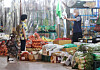 A person shops for groceries at a market in Seoul on Monday. Prices of vegetables are rising rapidly due to hot weather and the rainy season. [YONHAP]