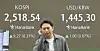 A person stands in front of a screen in Hana Bank's trading room in central Seoul on Feb. 6. [YONHAP]