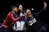 Korea's Oh Sang-uk, centre, winner of the gold medal in the men's individual Sabre competition, takes selfies with the event's silver medalist, Tunisia's Fares Ferjani, left, and bronze medalist, Italy's Luigi Samele, during the Paris 2024 Olympics, using the Samsung Galaxy Z Flip 6. [SAMSUNG ELECTRONICS/GETTY IMAGES]
